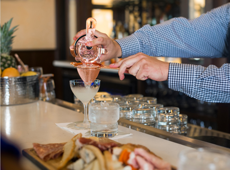 Bartender making a drink at Sortinos Bar.