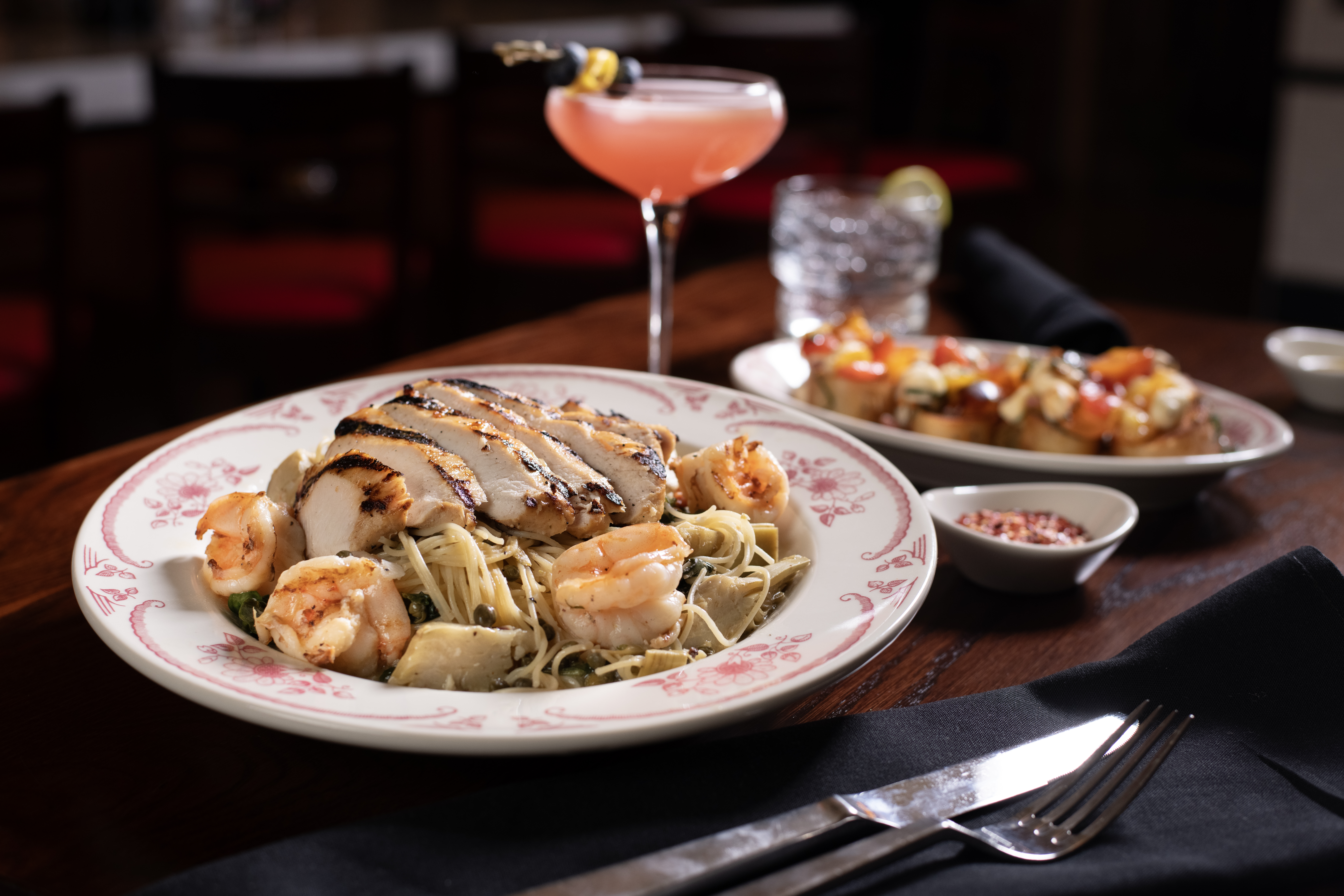 Sautéed chicken breast, shrimp, lemon-caper butter sauce, garlic spinach, artichokes, capellini pasta