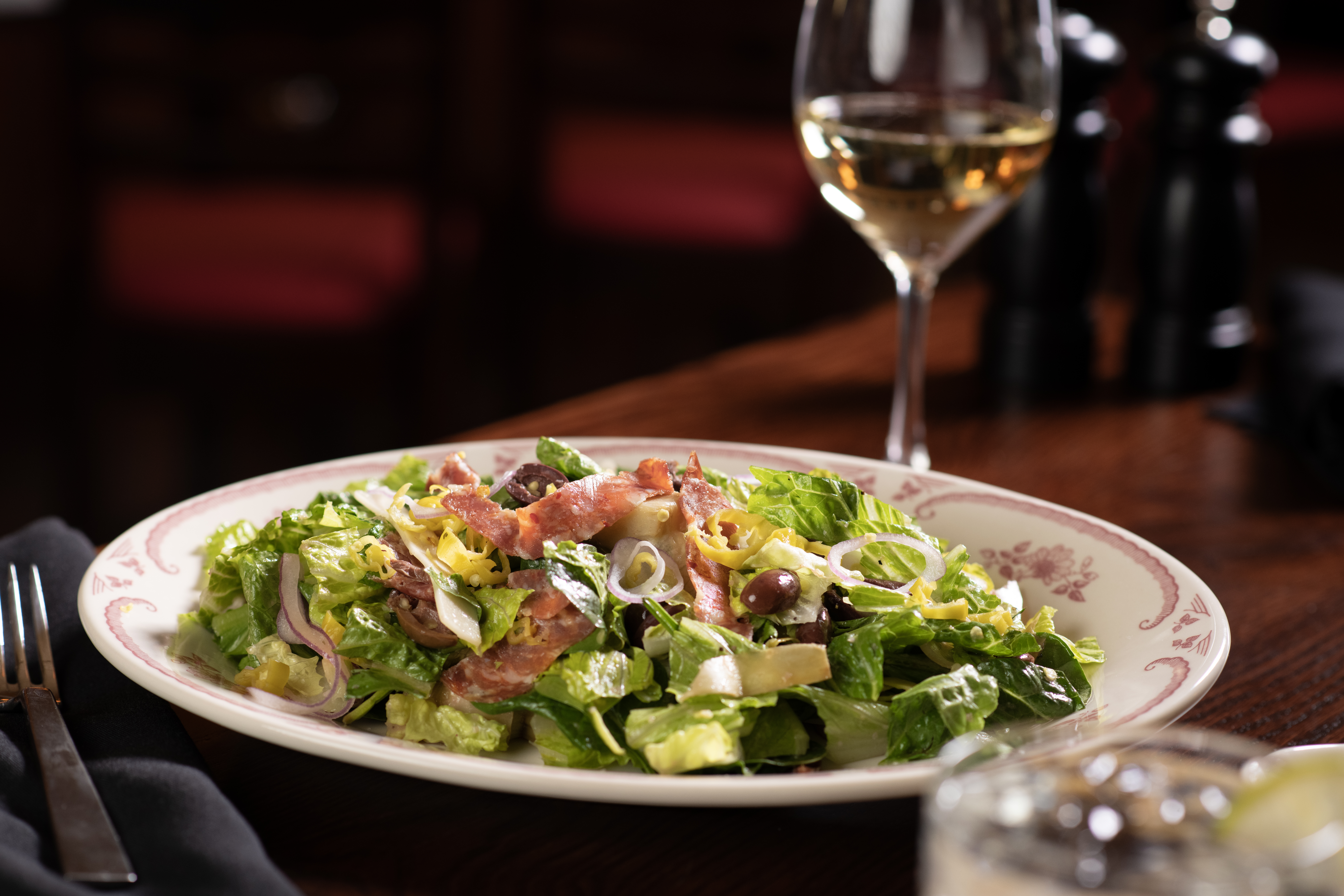 ANTIPASTO- Romaine, spinach, provolone, salami, artichokes, olives, red onion, pepperoncini,  red wine vinaigrette