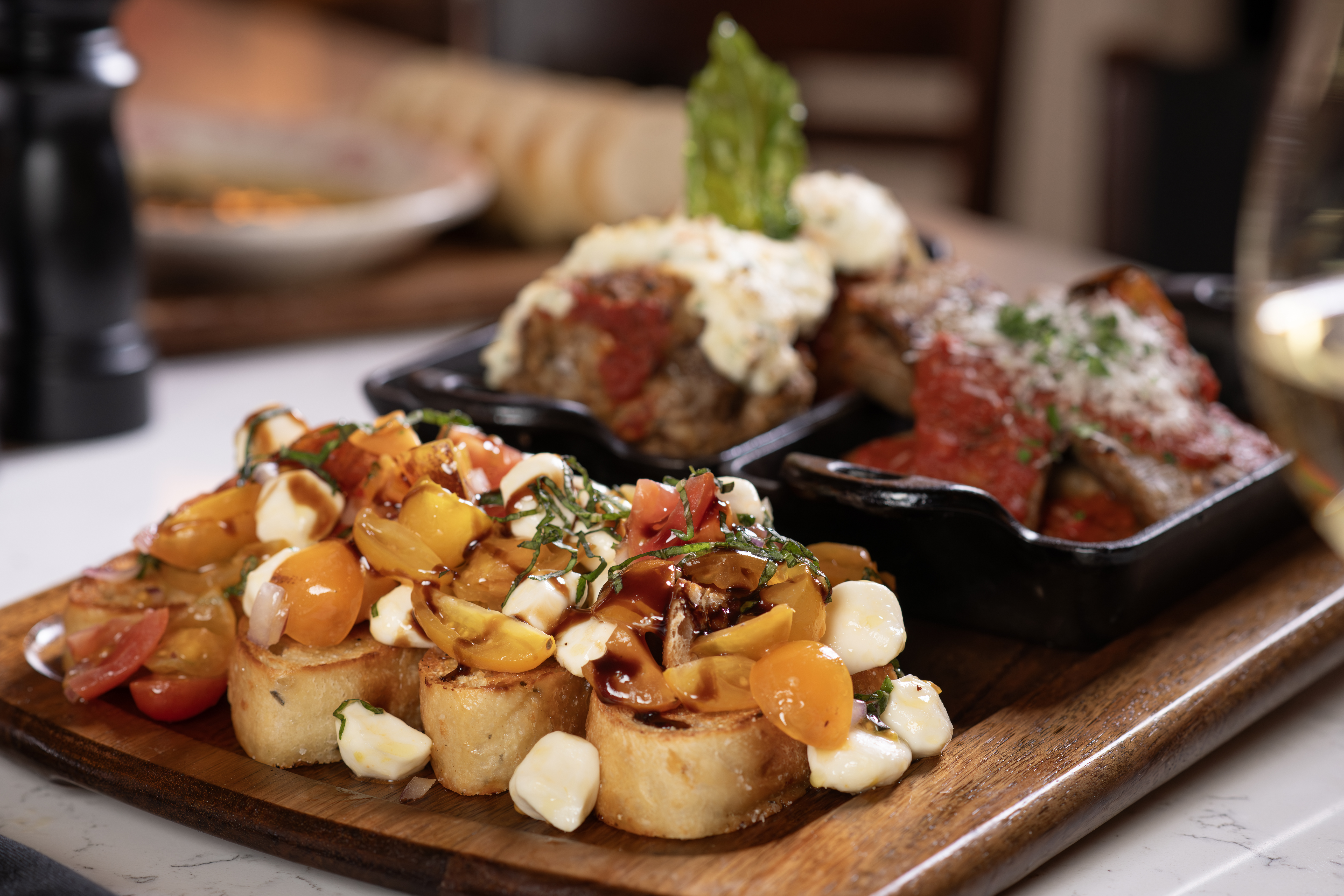 Housemade meatballs, tomato bruschetta, sausage, peppers